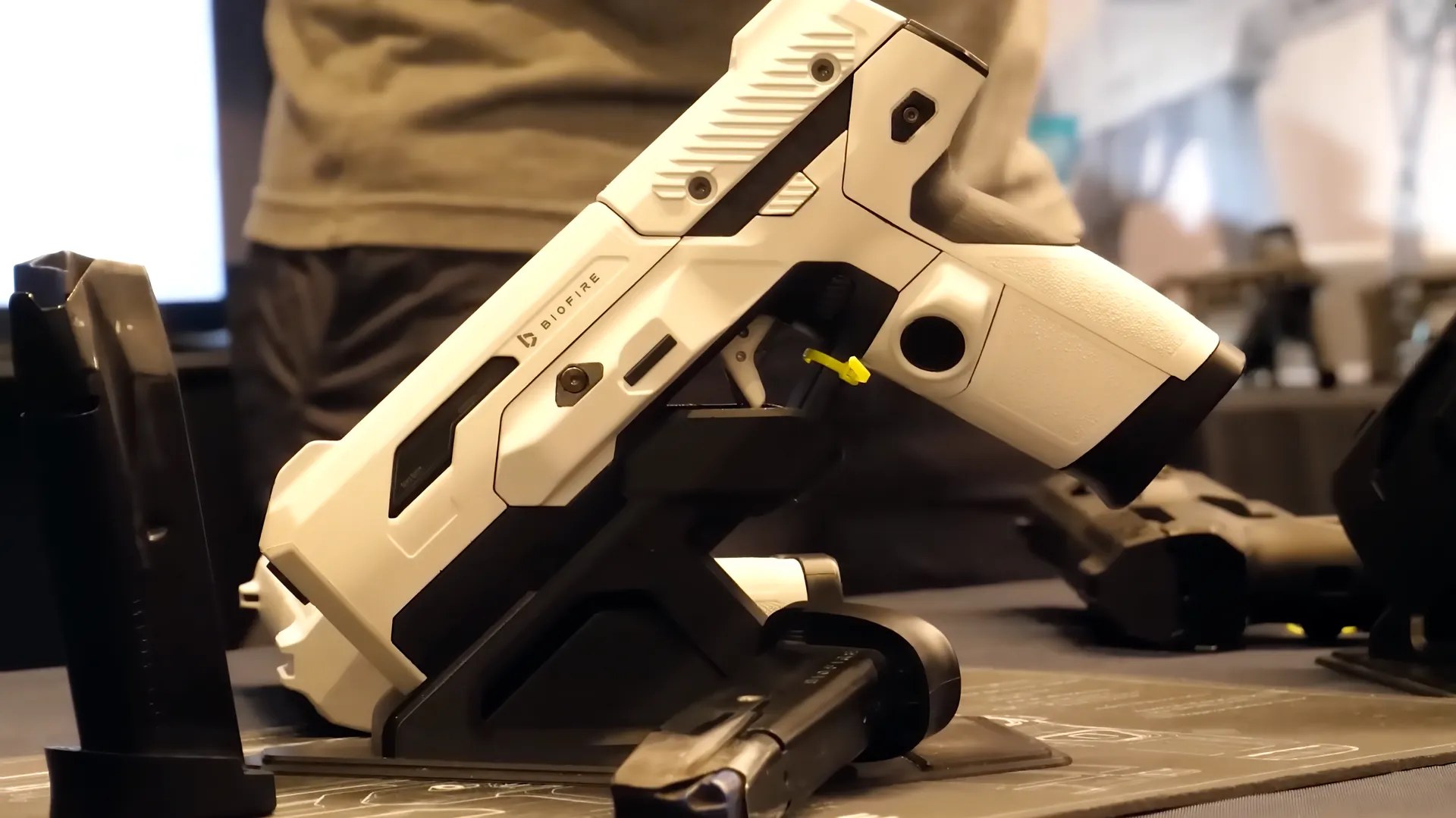 A white Biofire Smart Gun resting on its dock.